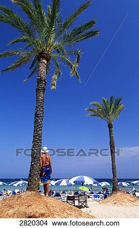 Tourists on beach, Playa den Bossa, Ibiza, Balearic Islands, Spain View Large Photo Image Picture - Tourists on beach, Playa den Bossa, Ibiza, Balearic Islands, Spain . Fotosearch
