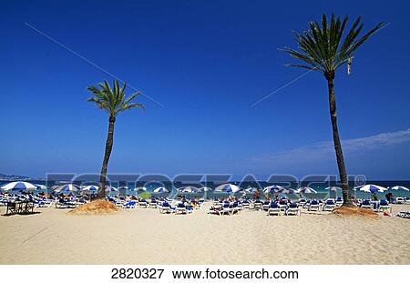 Tourists on beach, Playa den Bossa, Ibiza, Balearic Islands, Spain View Large Photo Image Stock Photo - Tourists on beach, Playa den Bossa, Ibiza, Balearic Islands, Spain . Fotosearch