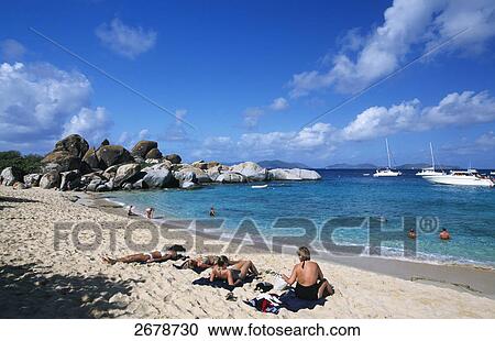Stock Image - Tourists on the beach, The Baths, Virgin Gorda, British Virgin Islands . Fotosearch