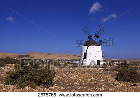 Traditional windmill on landscape, Valle de Santa Ines, Fuerteventura, Canary Islands, Spain View Large Photo Image Stock Photography - Traditional windmill on landscape, Valle de Santa Ines, Fuerteventura, Canary Islands, Spain . Fotosearch