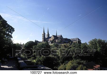 Stock Photo - Trees in front of church, St. Michael's Church, Bamberg, Franconia, Bavaria, Germany . Fotosearch