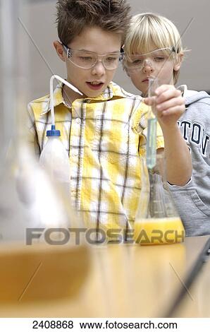 Stock Photo - Two boys doing science experiments . Fotosearch