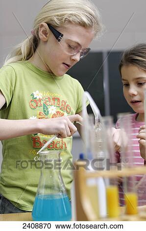 Two girls working in laboratory View Large Photo Image Stock Image - Two girls working in laboratory . Fotosearch