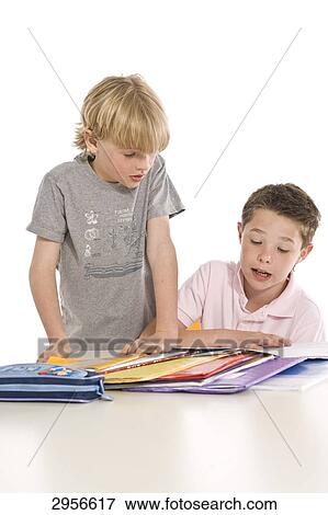 Stock Photo - two pupils doing school homework . Fotosearch