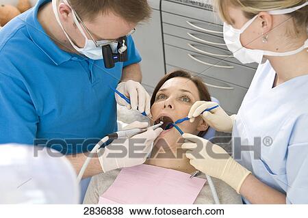 Woman at dentist View Large Photo Image Stock Photo - Woman at dentist . Fotosearch