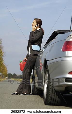 Woman having car breakdown, low angle view View Large Photo Image Stock Image - Woman having car breakdown, low angle view . Fotosearch