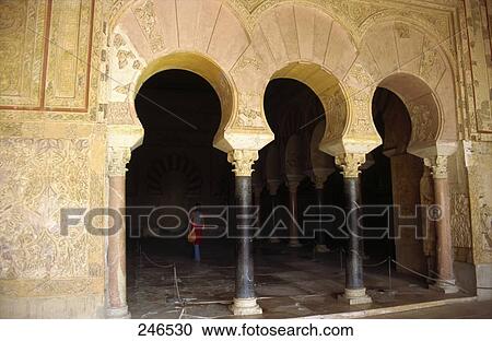 Stock Image - Woman in castle, Portico de Medina Azahara, Medina Azahara, Cordoba, Andalusia, Spain . Fotosearch
