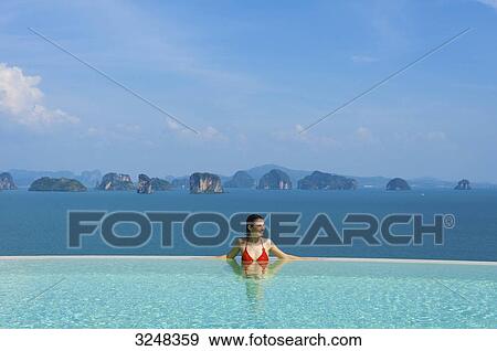 Woman in pool, Evason Six Senses Hideaway, Yao Noi, Thailand View Large Photo Image Stock Photo - Woman in pool, Evason Six Senses Hideaway, Yao Noi, Thailand . Fotosearch