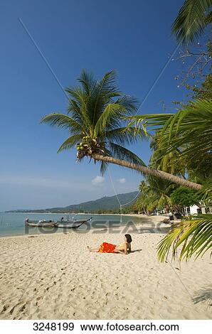 Woman lying at Lamai Beach, Ko Samui, Thailand View Large Photo Image Stock Photo - Woman lying at Lamai Beach, Ko Samui, Thailand . Fotosearch