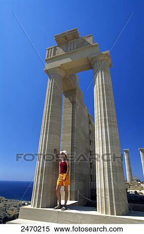Woman standing at ruins of temple, Lindos, Rhodes, Dodecanese Islands, Greece View Large Photo Image Stock Photography - Woman standing at ruins of temple, Lindos, Rhodes, Dodecanese Islands, Greece . Fotosearch