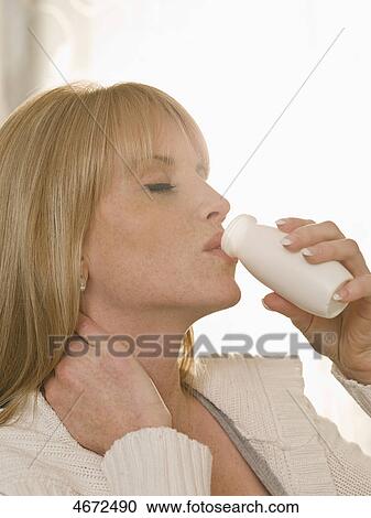 young woman drinking, side view View Large Photo Image Stock Image - young woman drinking, side view . Fotosearch