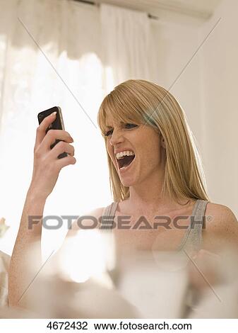 Young woman phoning in bed View Large Photo Image Stock Image - Young woman phoning in bed . Fotosearch