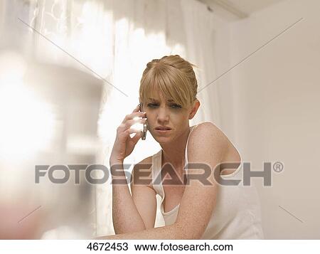 Young woman phoning in bed View Large Photo Image Stock Image - Young woman phoning in bed . Fotosearch
