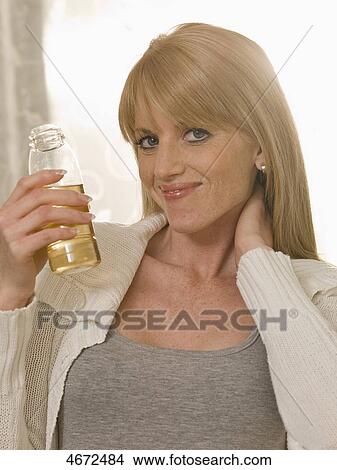 Young woman with plastic bottle View Large Photo Image Picture - Young woman with plastic bottle . Fotosearch