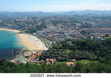 Stock Image - Aerial view of beach and town, Playa de Ondarreta, San Sebastian, Spain . Fotosearch