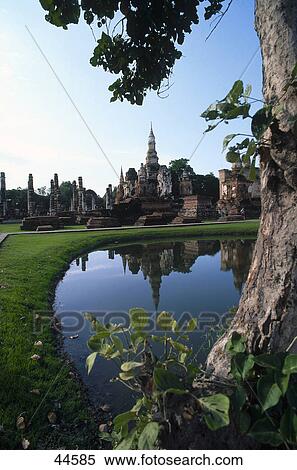 Ancient stupas reflected in pond water, Wat Mahathat, Sukhothai, Thailand View Large Photo Image Stock Photography - Ancient stupas reflected in pond water, Wat Mahathat, Sukhothai, Thailand . Fotosearch