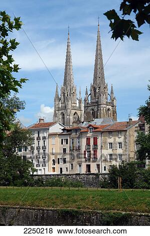 Apartments in front of cathedral View Large Photo Image Stock Photo - Apartments in front of cathedral . Fotosearch