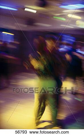 Blurred view of couple dancing View Large Photo Image Stock Image - Blurred view of couple dancing . Fotosearch