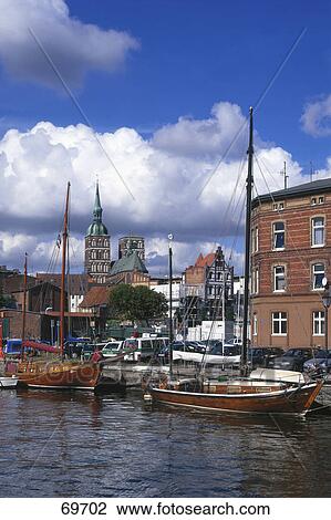 Boats at harbor with church in background, Sankt-Nikolai Church, Stralsund, Mecklenburg-Western Pomerania, Germany View Large Photo Image Stock Image - Boats at harbor with church in background, Sankt-Nikolai Church, Stralsund, Mecklenburg-Western Pomerania, Germany . Fotosearch
