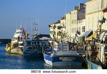 Boats in a row at the marina View Large Photo Image Stock Photo - Boats in a row at the marina . Fotosearch
