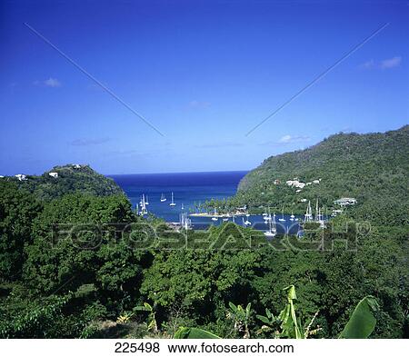 Boats in bay at coast View Large Photo Image Stock Photo - Boats in bay at coast . Fotosearch