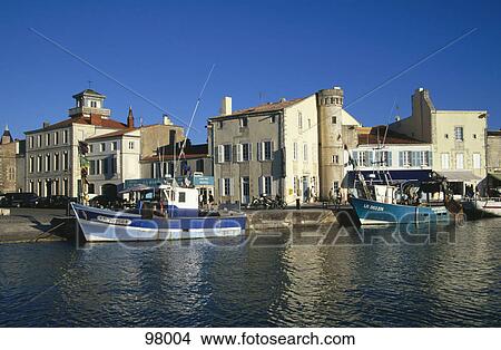 Boats in the canal with houses in the background, France View Large Photo Image Picture - Boats in the canal with houses in the background, France . Fotosearch