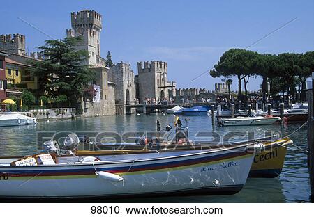 Boats in water in front of castle, Castle Scaliger, Sirmione, Italy View Large Photo Image Stock Image - Boats in water in front of castle, Castle Scaliger, Sirmione, Italy . Fotosearch