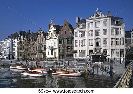 Picture - Boats moored at harbor in front of historical houses, Gent, Belgium . Fotosearch