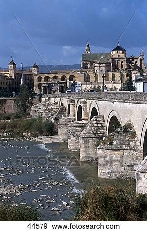 Bridge across river in town, Puente Romano, Cordoba, Roman Bridge, Andalusia, Spain View Large Photo Image Stock Photo - Bridge across river in town, Puente Romano, Cordoba, Roman Bridge, Andalusia, Spain . Fotosearch