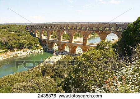Stock Photograph - Bridge across river, Pont Du Gard, Nimes, Languedoc Roussillon, France . Fotosearch