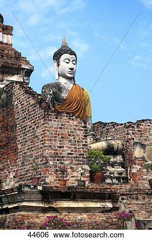 Buddha statue among old ruins of temple, Wat Yai Chai Mongkol, Ayutthaya, Thailand View Large Photo Image Stock Photograph - Buddha statue among old ruins of temple, Wat Yai Chai Mongkol, Ayutthaya, Thailand . Fotosearch