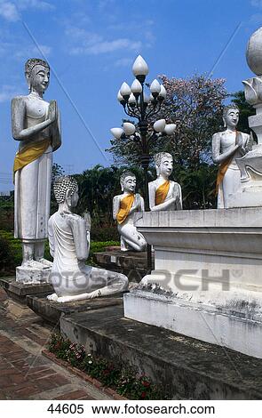 Buddha statues in prayer positions, Wat Yai Chai Mongkol, Ayutthaya, Thailand View Large Photo Image Stock Photography - Buddha statues in prayer positions, Wat Yai Chai Mongkol, Ayutthaya, Thailand . Fotosearch