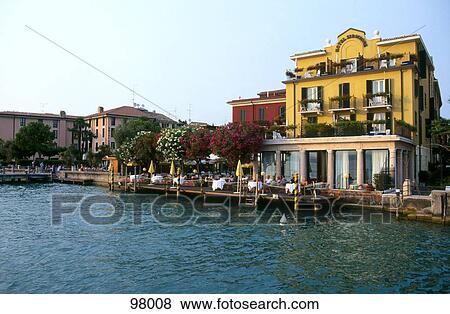 Building at lakefront, Lake Garda, Sirmione, Lombardy, Italy View Large Photo Image Stock Photo - Building at lakefront, Lake Garda, Sirmione, Lombardy, Italy . Fotosearch