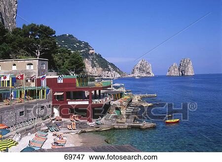 Buildings at waterfront, Marina Piccola, Faraglioni, Capri Island, Naples, Italy View Large Photo Image Stock Photo - Buildings at waterfront, Marina Piccola, Faraglioni, Capri Island, Naples, Italy . Fotosearch