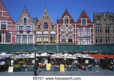 Cafes and restaurants in front of row houses, Grand Place, Bruges, Belgium View Large Photo Image Stock Photo - Cafes and restaurants in front of row houses, Grand Place, Bruges, Belgium . Fotosearch