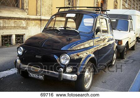 Stock Photograph - Cars parked at parking lot, Rome, Italy . Fotosearch