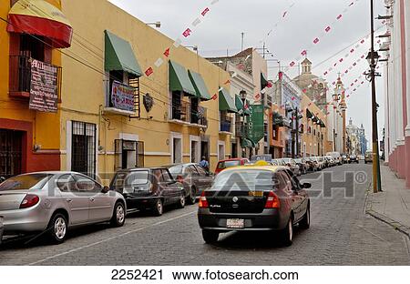 Cars parked at roadside View Large Photo Image Stock Image - Cars parked at roadside . Fotosearch