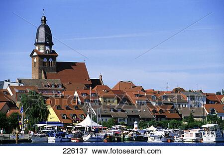 Church in a town of lakeside, St. Marien Church, Mueritz Lake, Germany View Large Photo Image Stock Photo - Church in a town of lakeside, St. Marien Church, Mueritz Lake, Germany . Fotosearch