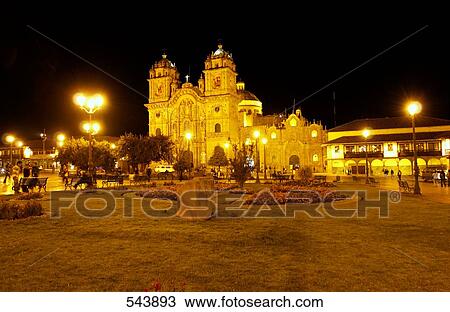 Stock Image - Church lit up at night, Iglesia La Compania De Jesus, Plaza-De-Armas, Cuzco, Cusco Region, Peru . Fotosearch