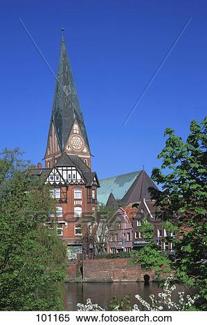 Stock Photography - Church spire against blue sky, St. John's Church, Lunenburg, Germany . Fotosearch