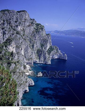 Stock Photograph - Cliffs on a coast, Capri, Italy . Fotosearch