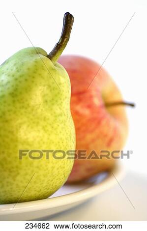 Close-up of apple and pear on plate View Large Photo Image Stock Image - Close-up of apple and pear on plate . Fotosearch