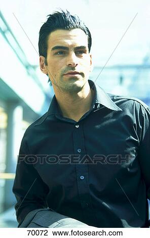 Close-up of businessman looking serious View Large Photo Image Stock Image - Close-up of businessman looking serious . Fotosearch