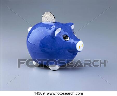 Close-up of coin in piggy bank slot View Large Photo Image Stock Photo - Close-up of coin in piggy bank slot . Fotosearch