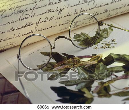 Stock Photography - Close-up of eyeglasses and letter . Fotosearch