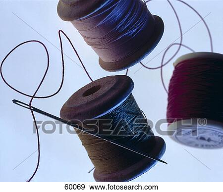 Close-up of needle and spools of thread View Large Photo Image Stock Photo - Close-up of needle and spools of thread . Fotosearch