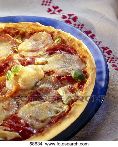 Close-up of pizza on plate View Large Photo Image Picture - Close-up of pizza on plate . Fotosearch