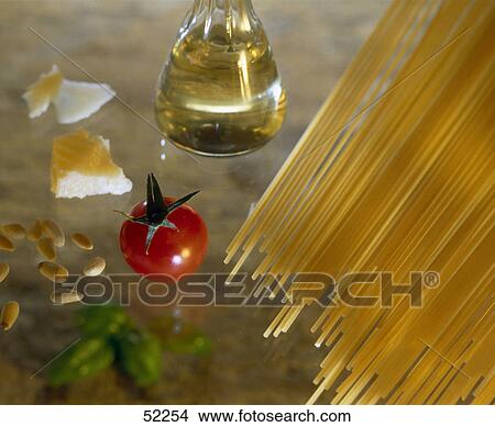 Picture - Close-up of raw spaghetti with olive oil and tomatoes . Fotosearch