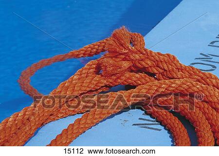 Stock Image - Close-up of rope at poolside . Fotosearch