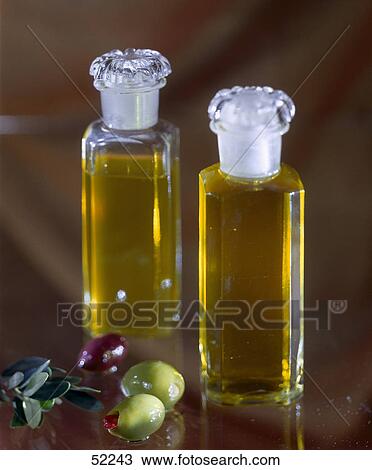 Close-up of two bottles of olive oil View Large Photo Image Stock Image - Close-up of two bottles of olive oil . Fotosearch